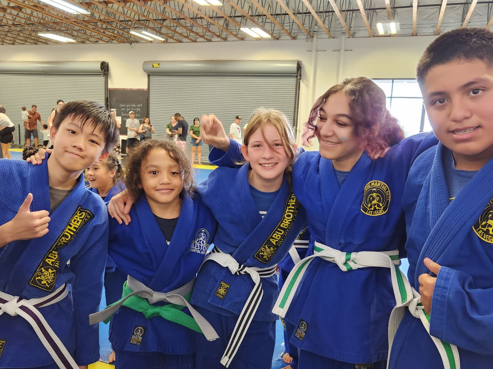 Martial arts students in blue uniforms